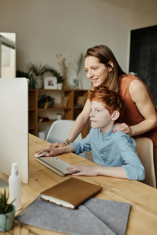 Parent guiding child through assessment process