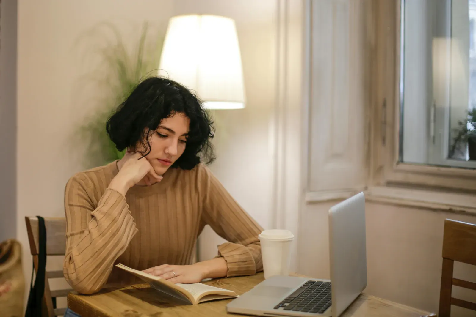 Young person in a thoughtful, comfortable setting