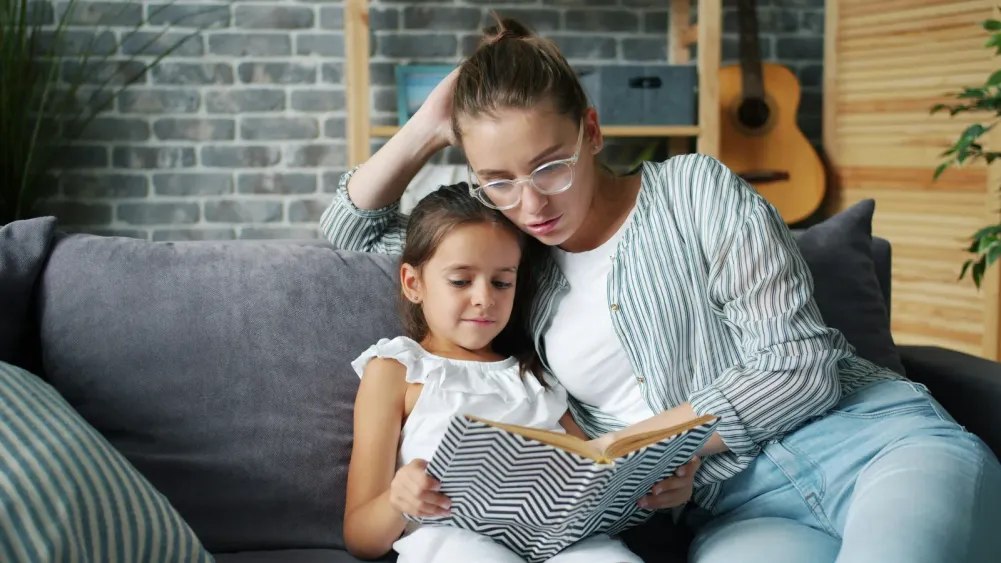 Parent and child drawing together at home